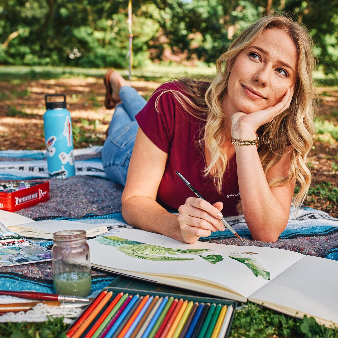 Sandy painting and drawing anatomical art with watercolors outside in Sarasota, Florida